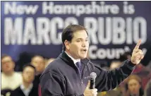  ?? JIM COLE/ASSOCIATED PRESS ?? Republican presidenti­al candidate Sen. Marco Rubio, R-Fla., speaks during a campaign stop at a high school cafeteria Sunday in Londonderr y, N.H.