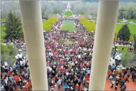  ?? Timothy D. Easley ?? The Associated Press Teachers from across Kentucky gather Monday outside the state Capitol in Frankfort to rally for increased funding and to protest changes to their state-funded pension system.