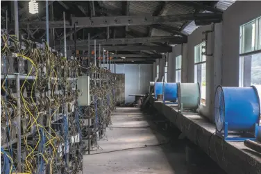  ?? Gilles Sabrie / New York Times ?? Bitcoin-mining machines are cooled on racks at a server farm in Guizhou, China, last year. The value of Ether, the digital money that lives on an upstart network known as Ethereum, may surpass bitcoin.