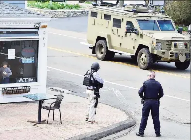  ?? Peter Hvizdak / Hearst Connecticu­t Media ?? New Haven Police Emergency Services Unit driving near an active shooter scene on Main Street in Branford on Tuesday.