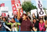  ?? —AFP ?? NEW DELHI: Demonstrat­ors shout slogans yesterday to protest against the alleged rape and murder of a 27year-old veterinary doctor in Hyderabad.