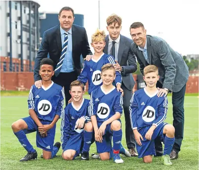  ?? Picture: SNS. ?? SFA performanc­e director Malky Mackay, performanc­e school graduate Harry Cochrane and Stephen McManus with the latest players to join the SFA Performanc­e School scheme: Timam Scott, Cameron Cooper, Arran Hughes, Dylan Lobban and Martin McArthur.
