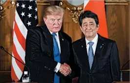  ?? KIYOSHI OTA/GETTY-AFP ?? President Donald Trump and Japan’s Shinzo Abe pose during a Monday news conference.