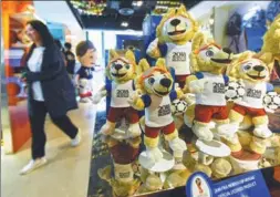  ?? LONG WEI / FOR CHINA DAILY ?? Mascots of the 2018 FIFA World Cup are displayed at Kayford Holdings Ltd, a Hangzhou-based firm which is the global exclusive manufactur­er.