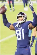  ?? Mark Zaleski / Associated Press ?? Titans tight end Jonnu Smith (81) celebrates after scoring a touchdown against the Bills in 2020.