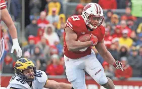  ?? RICK WOOD / MILWAUKEE JOURNAL SENTINEL ?? Badgers running back Jonathan Taylor leads the Big Ten in rushing with an average of 150.5 yards per game.