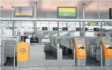  ?? /Reuters ?? Empty Lufthansa ticket counters are pictured at Munich's internatio­nal airport, as the spread of the coronaviru­s disease continues in Germany.
Turmoil deepens: