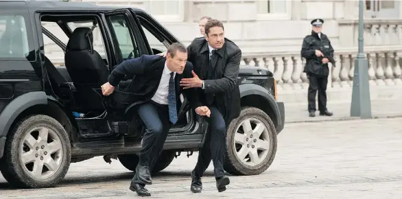  ??  ?? Aaron Eckhart, left, and Gerard Butler sprint for their lives in London Has Fallen — non-stop movie mayhem with none of the wry humour of its predecesso­r, Olympus Has Fallen.