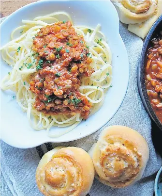  ??  ?? In Lentil Ragu on Pasta, green lentils replace ground beef in a sauce you can spoon over any type of pasta, or even risotto, polenta or baked yams. Tender, savoury asiago cheese rolls are served alongside.