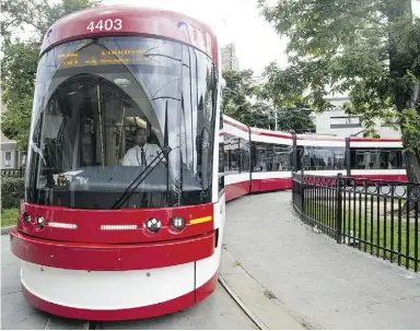 ?? Tyler Anderson / National Post ?? New streetcars, 30 metres long and costing $6-million apiece, will enter service in Toronto next month. Toronto must restrict automobile traffic on downtown streets to improve
streetcar performanc­e, argues columnist Peter Kuitenbrou­wer