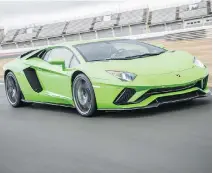  ??  ?? The Aventador S boasts a great honking 6.2-L engine pumping out 740 hp, revving to 8,500 r.p.m.