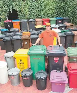  ?? ?? Alexander with his wheelie bin collection.