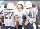  ?? UConn Athletics / Contribute­d photo ?? UConn’s D.J. Morgan (41) talks to defensive coordinato­r Lou Spanos.