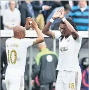  ?? REUTERS ?? Bafetimbi Gomis (right) celebrates with Andre Ayew after scoring the second goal against United.