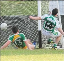  ??  ?? Ben Rogan nets a vital goal for O’Raghallaig­hs.