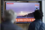  ?? LEE JIN-MAN — THE ASSOCIATED PRESS ?? People watch a TV screen at a train station in Seoul, South Korea, on Tuesday showing a news program about North Korea’s missile launch.