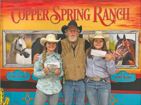  ?? (Courtesy Photo/Yvonne Tapia) ?? Demaris Alcon (from left), her grandfathe­r, Andy Alcon, and younger sister, Noralynn Alcon, after winning at a competitio­n in Andrews, Texas. Demaris Alcon’s goal is to make it to the rodeo finals in Nevada in December.