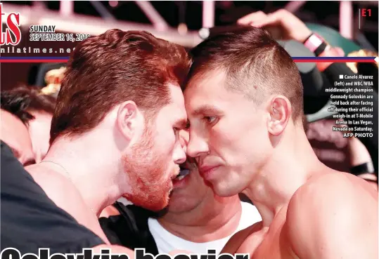  ?? AFP PHOTO ?? Canelo Alvarez (left) and WBC/WBA middleweig­ht champion Gennady Golovkin are held back after facing off during their official weigh-in at T-Mobile Arena in Las Vegas, Nevada on Saturday.