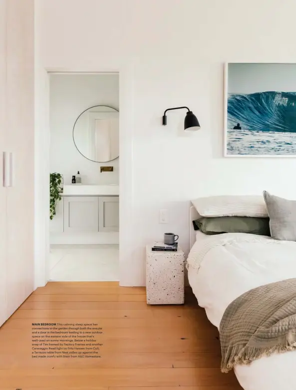  ??  ?? MAIN BEDROOM This calming sleep space has connection­s to the garden through both the ensuite and a door in the bedroom leading to a new outdoor space on the eastern side of the house that's well-used on sunny mornings. Below a holiday snap of Tim framed by Factory Frames and another Caravaggio Read light by Fritz Hansen from Cult, a Terrazzo table from Nest sidles up against the bed made comfy with linen from A&C Homestore.