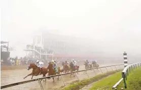  ?? JEN RYNDA/BALTIMORE SUN MEDIA GROUP ?? Justify leads in the 143rd Preakness Stakes at Pimlico Race Course in Baltimore. A proposal calls for a $424 million rebuilding of the race course.