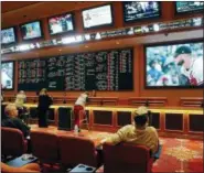  ?? JOHN LOCHER — THE ASSOCIATED PRESS ?? Now that the U.S. Supreme Court has cleared the way for states to legalize sports betting, the race is on among gambling and technology firms to see who will get a foothold in a market worth billions.