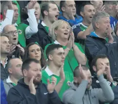  ??  ?? So near: Northern Ireland fans at Windsor Park on Monday