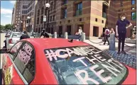  ?? Peter Hvizdak / Hearst Connecticu­t Media file photo ?? A New Haven contingent of the #CancelTheR­ents car rallies prepares to leave New Haven City Hall on March 30, 2020.