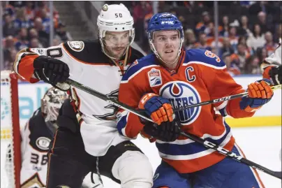  ?? CP PHOTO ?? Anaheim Ducks’ Antoine Vermette (left) and Edmonton Oilers’ Connor Mcdavid vie for position in front of the net during NHL action in Edmonton, Alta. on April 1.