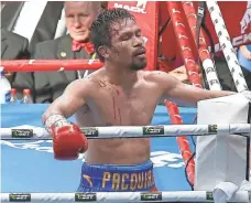  ?? TERTIUS PICKARD, AP ?? Manny Pacquiao lost to Jeff Horn by unanimous decision July 2. Pacquiao’s trainer says head gashes affected the fighter.