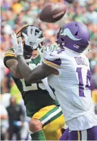  ?? MARK HOFFMAN/MILWAUKEE JOURNAL SENTINEL ?? Vikings wide receiver Stefon Diggs beats Packers cornerback Jaire Alexander to reel in a 45-yard touchdown reception.