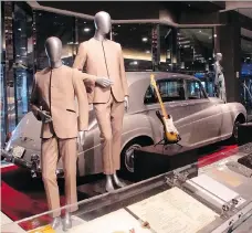  ?? WAYNE PARRY/THE ASSOCIATED PRESS ?? Suits worn by the Beatles during an early U.S. tour are set up in front of a Rolls-royce owned by Elvis Presley as part of a large collection of music memorabili­a.