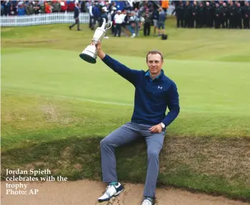  ??  ?? Jordan Spieth celebrates with the trophy Photo: AP