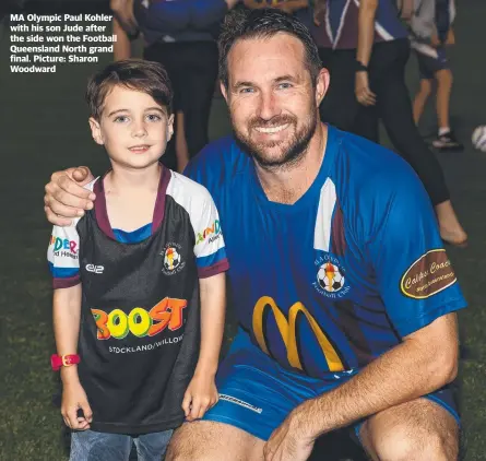  ?? ?? MA Olympic Paul Kohler with his son Jude after the side won the Football Queensland North grand final. Picture: Sharon Woodward