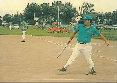  ?? SUBMITTED PHOTO ?? Frank Bursey was known for his passion for baseball. Bursey coached many baseball teams over the years, while also helping to run the local minor baseball associatio­n for many years in New Waterford. Bursey is shown hitting ground balls to one of ball teams.