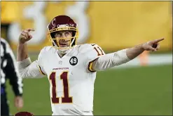  ?? KEITH SRAKOCIC — THE ASSOCIATED PRESS ?? Washington Football Team quarterbac­k Alex Smith (11) calls a play during the second half of an NFL game against the Pittsburgh Steelers, Monday.