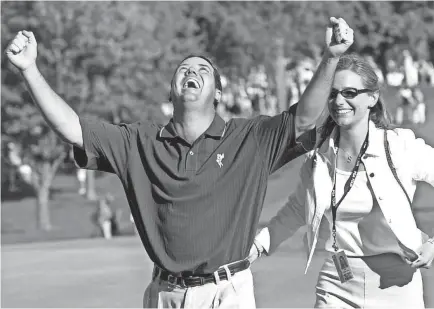  ?? ANN HEISENFELT/AP ?? Rich Beem celebrated on the 18th green with wife Sara after winning the 84th PGA Championsh­ip at Hazeltine National Golf Club in Chaska, Minnesota, in 2002.