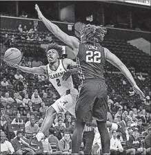  ?? [MARY ALTAFFER/THE ASSOCIATED PRESS] ?? Alabama guard Collin Sexton drives to the basket against Minnesota center Reggie Lynch. Sexton scored 40 points, but Minnesota won 89-84.