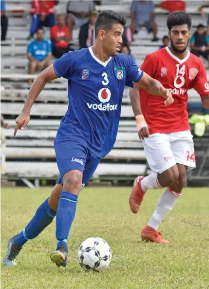  ?? Photo: ?? Lautoka midfield general Zibraaz Sahib looks for a gap in the Rewa defence as Josaia Sela closes in during their Vodafone Premier League clash at Ratu Cakobau Park, Nausori on July 26, 2020. Sela scored Rewa’s lone goal.