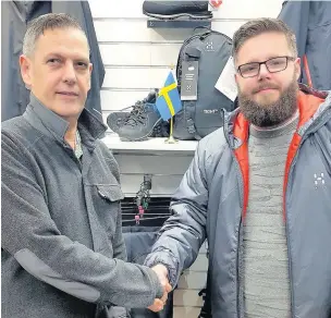  ??  ?? Keith Dawson (left), who set up The Fell & Mountain shop in Accrington, with new owner Luke Daly