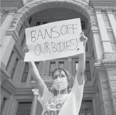  ?? JAY JANNER/AUSTIN AMERICAN-STATESMAN ?? Jillian Dworin participat­es in a protest against the abortion ban at the Capitol in Austin, Texas.