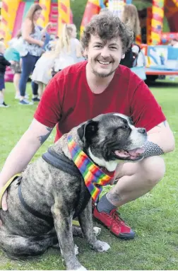  ??  ?? Mark Mcclymont with his dog Bramble at the Picnic in the Park event, organised by Pride in Gloucester­shire Pictures: Anna Lythgoe
