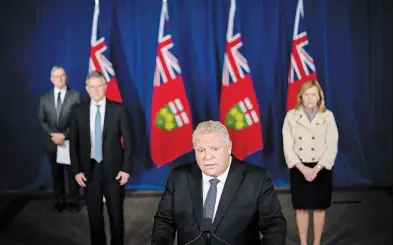  ?? NATHAN DENETTE THE CANADIAN PRESS ?? Premier Doug Ford said “we have some difficult, but necessary decisions to make” as Toronto and Peel face a lockdown.