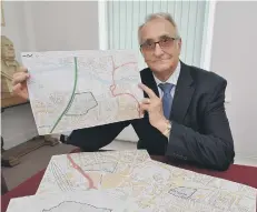  ?? ?? Cllr Holdich holding plans for the university campus