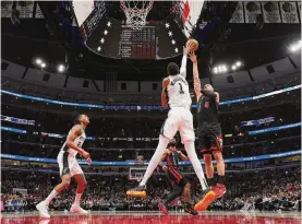  ?? Michael Reaves/getty Images ?? Victor Wembanyama (1) and the Spurs play the Bulls for the third time today. The rookie averaged 14 points, 12.5 rebounds and 3.5 blocks in the two previous games.
