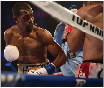  ?? (AP/Kevin Hagen) ?? Jamel Herring keeps Juan Pablo Sanchez on the ropes during their lightweigh­t bout May 12 in New York. Herring was supposed to fight Jonathan Oquendo tonight, but the fight was postponed after Herring tested positive for covid-19.