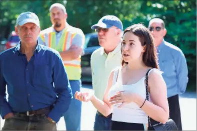  ?? Jarret Liotta / Hearst Connecticu­t Media ?? Neighbor Alba Dexheimer asks a question of Eversource officials Wednesday morning at a meeting at the cul de sac of Little Brook Road.