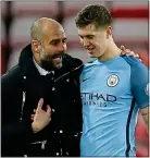  ??  ?? FAITH: Guardiola and Stones