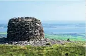  ??  ?? The cairn on the south summit gives impressive views over the Furness Peninsula and Walney Island.