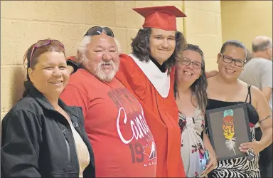  ?? ASHLEY THOMPSON ?? Graduate Charlie Francis, originally of Indian Brook, was surrounded by family as he waited for the graduation ceremony to begin.