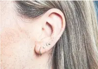  ??  ?? The Kit’s digital director, Caitlin Kenny, opted for an asymmetric­al approach with four piercings in her left ear.